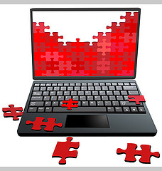 puzzle pieces falling off laptop