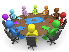 puzzle pieces meeting table